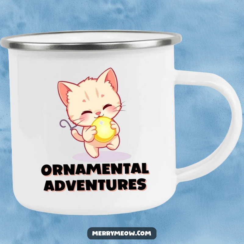 Funny camping mug showing a kitten joyfully chasing a glowing holiday ornament, bringing festive fun to outdoor adventures.