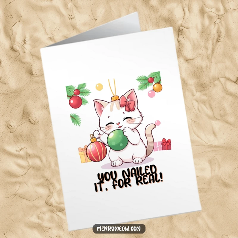 Funny Free Printable Congratulations Card: A cat character humorously plays with a Christmas ornament.