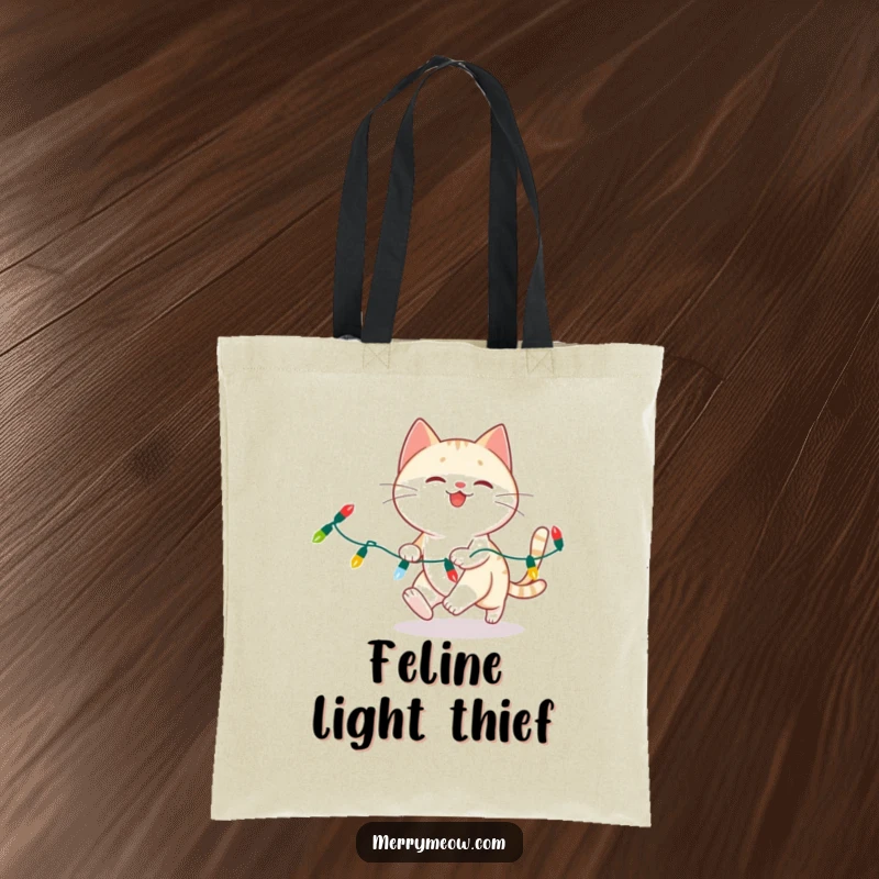 Funny cat chasing Christmas lights on a reusable tote bag, perfect for holiday errands.